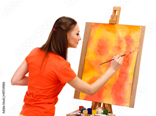 Photo: beautiful young woman painter at work, isolated on white beautiful young woman painter at work, isolated on white