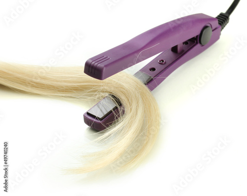 Photo: Hair straighteners and hair, isolated on white Hair straighteners and hair, isolated on white