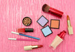 Decorative cosmetics on pink background