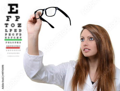 Photo: Pretty doctor portrait with glasses in her hand Pretty doctor portrait with glasses in her hand