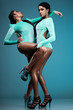 two dancers in blue costumes