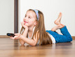girl holding a remote control