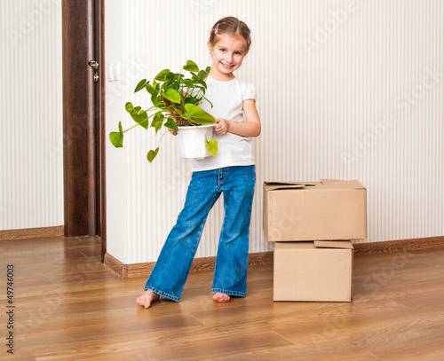Photo: Little girl moving into new house Little girl moving into new house