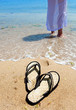 Beach slippers on sand