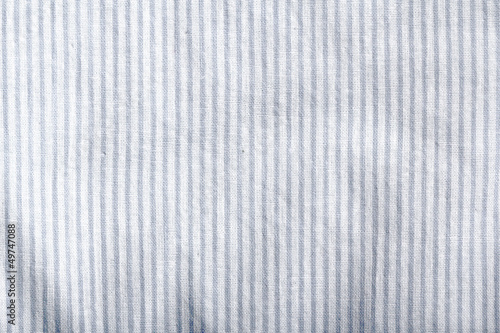 Photo: White striped fabric texture. Clothes background. Close up White striped fabric texture. Clothes background. Close up