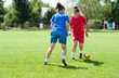 girls playing football outside