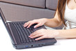 Closeup of woman hands using laptop