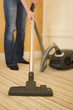 Vacuum cleaning bedroom in new house