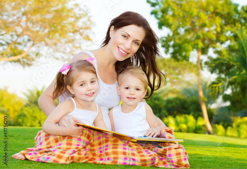 Photo: Mother with children read book Mother with children read book