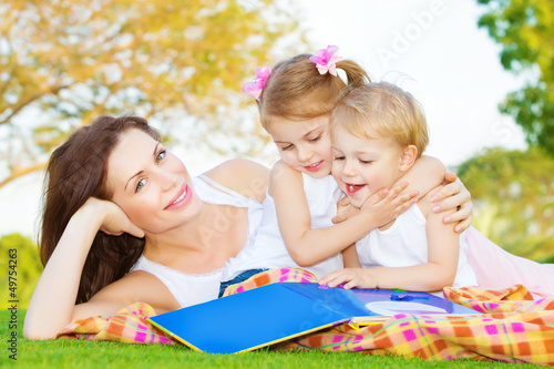 Photo: Mother with two kids outdoors Mother with two kids outdoors
