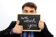 "we want you" Mann hält Schild, Business, Arbeit