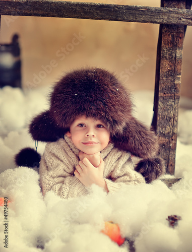 Photo: creative photo card is a smiling boy in a fur hat creative photo card is a smiling boy in a fur hat