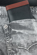 Purse in the pocket of jeans