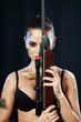 woman holding weapon