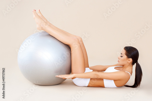 Photo: Doing abdominal muscles with fitness ball Doing abdominal muscles with fitness ball