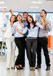 Business group with arms up