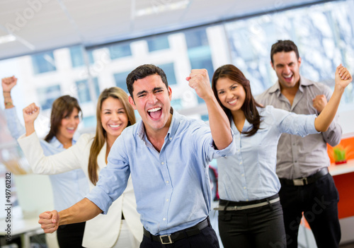Photo: Business team celebrating a triumph Business team celebrating a triumph