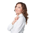 Beautiful young woman daydreaming