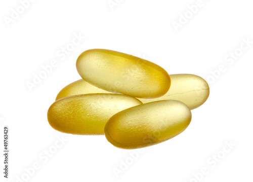 Photo: Yellow semi-transparent pills isolated on white background Yellow semi-transparent pills isolated on white background