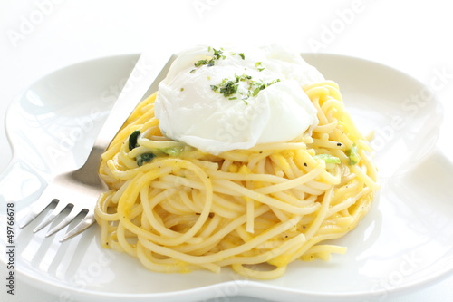 Photo: italian cuisine, poached egg on carbonara spaghetti italian cuisine, poached egg on carbonara spaghetti