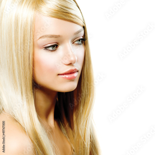 Photo: Beautiful Blond Girl isolated on a White Background Beautiful Blond Girl isolated on a White Background