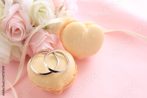 Photo: heart shape macaroon with flower bouquet for wedding background heart shape macaroon with flower bouquet for wedding background