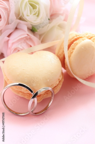 Photo: heart shape macaroon with flower bouquet for wedding background heart shape macaroon with flower bouquet for wedding background