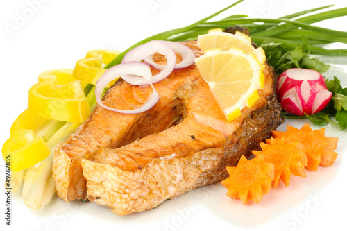 Photo: Appetizing grilled salmon with lemon and vegetables isolated Appetizing grilled salmon with lemon and vegetables isolated