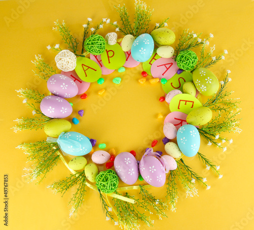 Photo: Circular composition for Easter on yellow background Circular composition for Easter on yellow background
