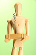 Mannequin with corkscrew, on green background