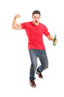 Full length portrait an euphoric fan holding a beer bottle and c
