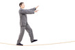 Full length portrait of a young man in pajamas sleepwalking on a