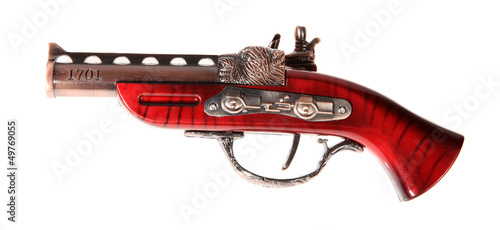 Photo: Model of the old gun on the white background, souvenir Model of the old gun on the white background, souvenir