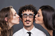 Double kiss from his girlfriends