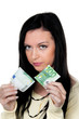 Foto: Frau mit halben Euro Geldschein. Steuern.Inflation. Frau mit halben Euro Geldschein. Steuern.Inflation.