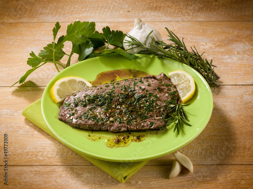 Photo: beef steack with garlic and mixed herbs beef steack with garlic and mixed herbs