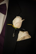 white rose wedding groom boutinerre formal event