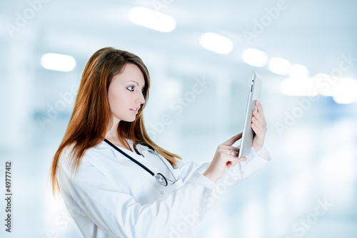 Photo: gorgeous nurse Using Digital Tablet gorgeous nurse Using Digital Tablet