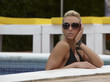 Beautiful Woman in a Swimming Pool During Summer