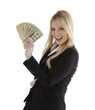 Photo: Confident young businesswoman holding currency notes and smiling Confident young businesswoman holding currency notes and smiling