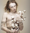 Bloke. Daydreaming Young Man holding Bouquet of Flowers. Cotton