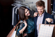 Attractive woman and young man go shopping