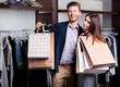 Foto: Laughing couple after shopping at the store Laughing couple after shopping at the store