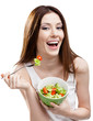 Foto: Dieting woman eats green salad in salad bowl, isolated on white Dieting woman eats green salad in salad bowl, isolated on white