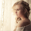 portrait of a beautiful blonde at the window