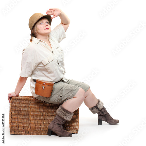 Photo: Retro style traveler with suitcase going on a vacation. Retro style traveler with suitcase going on a vacation.