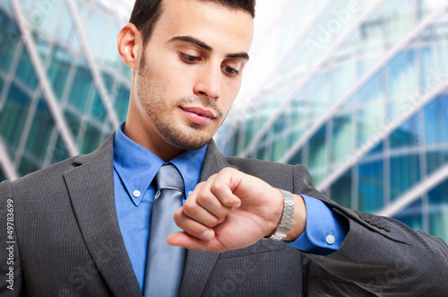Photo: Businessman checking the time Businessman checking the time