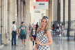 Beautiful Young Woman Is Posing  at the Railway Terminal