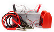 Car battery and  jumper cables  isolated on white