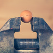 An Egg Cracking under Pressure from Vice (color toned Image)